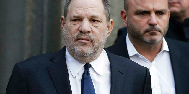In this Thursday, Dec. 20, 2018, file photo, Harvey Weinstein, center, leaves New York Supreme Court in New York. Weinstein's sexual assault trial in New York City is being delayed until June 3, 2019. (AP Photo/Mark Lennihan, File)