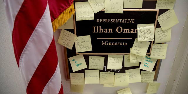 People leave post-it notes of support outside the office of Rep. Ilhan Omar, D-Minn., on Capitol Hill, Monday, Feb. 11, 2019, in Washington. Omar has "unequivocally" apologized for tweets suggesting a powerful pro-Israel interest group paid members of Congress to support Israel. Earlier Monday, House Speaker Nancy Pelosi and other Democrats had rebuked her for the tweets. (AP Photo/Andrew Harnik)