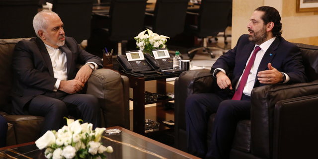 Lebanese Prime Minister Saad Hariri, right, meets with Iran's Foreign Minister Mohammad Javad Zarif, at the government palace, in Beirut, Lebanon, Monday, Feb. 11, 2019. Zarif extended an offer for Iranian military assistance to the U.S.-backed Lebanese army on Sunday, saying Iran is ready to assist in all sectors should the Lebanese government want it. (AP Photo/Hussein Malla)