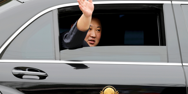 North Korean leader Kim Jong Un waves from a car after arriving by train in Dong Dang in a Vietnamese border town last month, ahead of his second summit with President Trump. (AP Photo/Minh Hoang)