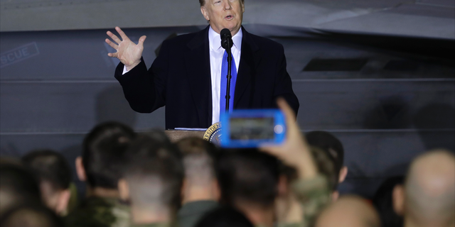 President Donald Trump speaks to service members at Joint Base Elmendorf-Richardson, Thursday, Feb. 28, 2019, in Anchorage, Alaska., during a refueling stop as he returns from Hanoi. (AP Photo/Evan Vucci)