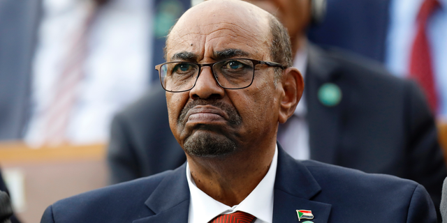 FILE - In this July 9, 2018, file photo, Sudan's President Omar al-Bashir attends a ceremony for Turkey's President Recep Tayyip Erdogan, at the Presidential Palace in Ankara, Turkey. Sudan's President has declared a state of emergency on Friday, Feb. 22, 2019, for a year and disbanded the government amid deadly protests. Al-Bashir — who seized power in a 1989 coup— also said Friday that for now he will not change the constitution to allow himself to seek a third term in office. (AP Photo/Burhan Ozbilici, File)