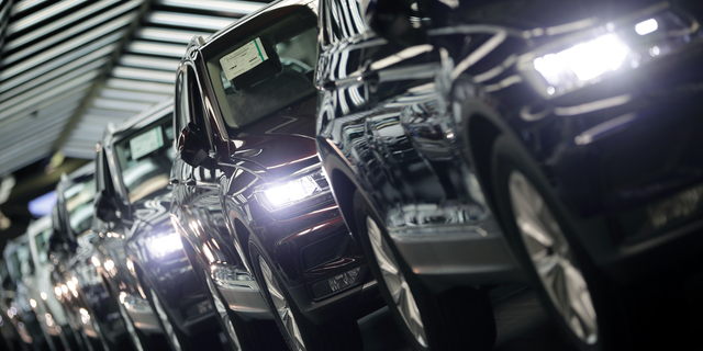 FILE - In this March 8, 2018 file photo photo Volkswagen cars are pictured during a final quality control at the Volkswagen plant in Wolfsburg, Germany. Germany's economic growth has stagnated in the last three months of the year. (AP Photo/Michael Sohn, file)