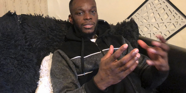 FILE - In this Dec. 31, 2018, file photo taken in in Delaware, Ohio, Shamieke Pugh discusses injuries he suffered in 2017 when a fellow inmate at the Southern Ohio Correctional Facility in Lucasville slipped out of his cuffs and allegedly stabbed Pugh and three other inmates multiple times as they sat handcuffed to a table and were unable to defend themselves. A pretrial hearing was scheduled for Tuesday, Feb. 12, 2019, for inmate Greg Reinke, who is accused in the 2017 knife attack on four other prisoners, and a 2018 stabbing attack on a guard who is still recovering from his injuries. (AP Photo/Andrew Welsh-Huggins, File)