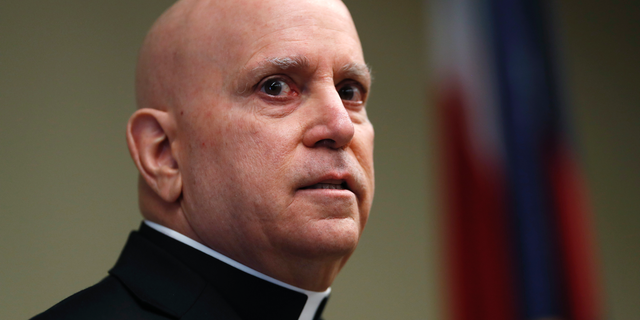Samuel Aquila, archbishop of the Denver diocese of the Roman Catholic Church, speaks about the plan to have a former federal prosecutor review the sexual abuse files of Colorado's Roman Catholic dioceses at a news conference Tuesday, Feb. 19, 2019, in Denver. The church will pay reparations to victims under a voluntary joint effort with the state attorney general. (AP Photo/David Zalubowski)