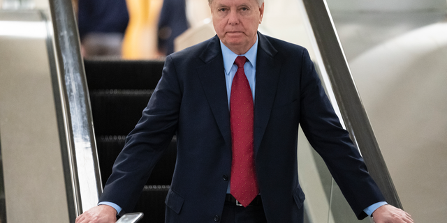 Senate Judiciary Committee Chairman Lindsey Graham, R-S.C., an ally of President Donald Trump, leaves the Senate after voting to confirm William Barr to be attorney general, on Capitol Hill in Washington, Thursday, Feb. 14, 2019. (AP Photo/J. Scott Applewhite)
