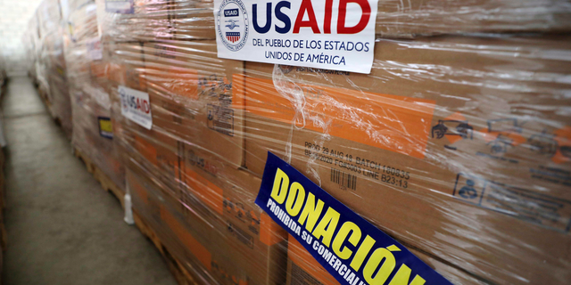 USAID humanitarian aid is stored at a warehouse next to the Tienditas International Bridge on the outskirts of Cucuta, Colombia, on the border with Venezuela, Tuesday, Feb. 19, 2019. The U.S. military airlifted tons of humanitarian aid as part of an effort meant to undermine socialist President Nicolas Maduro and back his rival for the leadership of the South American nation. (AP Photo/Fernando Vergara)