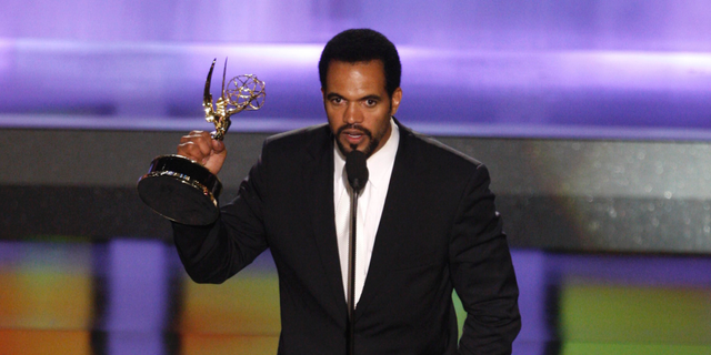 In this June 20, 2008, file photo, Kristoff St. John accepts the award for outstanding supporting actor in a drama series for his work on "The Young and the Restless" at the 35th Annual Daytime Emmy Awards in Los Angeles. 