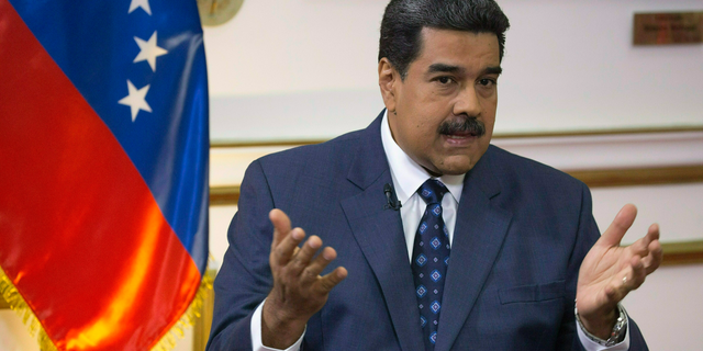 In this Feb. 14, 2019 file photo, Venezuela's President Nicolas Maduro speaks during an interview at Miraflores presidential palace in Caracas, Venezuela.