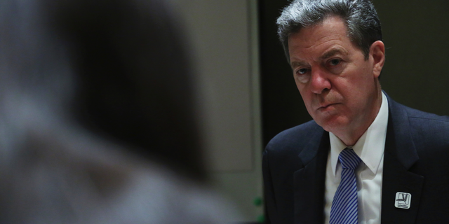 Sam Brownback, the U.S. ambassador-at-large for international religious freedom, speaks to journalists in Abu Dhabi, United Arab Emirates, Sunday, Feb. 24, 2019. Pakistan has "a desire to change" its ways and be removed from an American blacklist of countries that infringe religious freedoms, Brownback said Sunday on a tour of a Mideast long riven by faith. (AP Photo/Jon Gambrell)