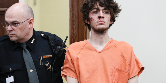 Suspect Wade Edward Winn, right, appears before Judge Kevin T. Miles at Clermont County Municipal Court into the shooting incident involving two officers of the Clermont County Sheriff's Office, Monday, Feb. 4, 2019, in Batavia, Ohio. Detective Bill Brewer died from gunshot wounds after being transported to Anderson Mercy Hospital. (AP Photo/John Minchillo)