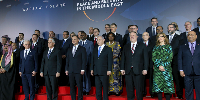 Front row third from left, United States Vice President Mike Pence, fourth from left, Poland's President Andrzej Duda, fifth from left, Israeli Prime Minister Benjamin Netanyahu and sixth from left, United States Secretary of State, Mike Pompeo, pose for a group photo at the Royal Castle in Warsaw, Poland, Wednesday, Feb. 13, 2019. The Polish capital is host for a two-day international conference on the Middle East, co-organized by Poland and the United States. (AP Photo/Michael Sohn)