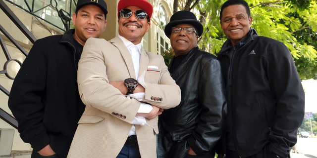 In this Tuesday, Feb. 26, 2019, Marlon Jackson, second from left, Tito Jackson, second from right, and Jackie Jackson, far right, brothers of the late musical artist Michael Jackson, and Tito's son Taj, far left, pose together for a portrait outside the Four Seasons Hotel, in Los Angeles. Jackie, Tito, Marlon and Taj Jackson, gave the first family interviews Tuesday on “Leaving Neverland,” which features two Michael Jackson accusers and is set to air on HBO starting Sunday, March 3. (Photo by Chris Pizzello/Invision/AP)