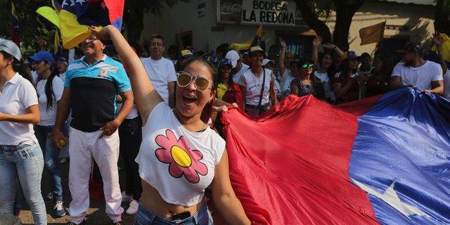 A woman shouts slogans against Venezuela's President Nicolas Maduro during a protest against his government in Urena, Venezuela, Tuesday, Feb. 12, 2019. Nearly three weeks after the Trump administration backed an all-out effort to force out President Nicolas Maduro, the embattled socialist leader is holding strong and defying predictions of an imminent demise. (AP Photo/Fernando Llano)