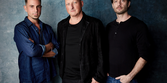FILE- In this Jan. 24, 2019, file photo Wade Robson, from left, director Dan Reed and James Safechuck pose for a portrait to promote the film "Leaving Neverland" at the Salesforce Music Lodge during the Sundance Film Festival in Park City, Utah.