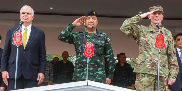 In this photo by release Royal Thai Armed Forced Headquarters, from left; acting U.S. ambassador Peter Haymond, The Royal Thai Armed Forces, Gen. Pornpipat Benyasri, Commander, and U.S. Army First Corps representing U.S. Indo-Pacific Command Lt. Gen. Gary J. Volesky salute during the opening ceremony of the joint military exercise Cobra Gold 2019, Phitsanulok Province, Thailand. Tuesday, Feb. 12, 2019. The exercise will take place from Feb. 12-22 focusing on military Field Training Exercise, Humanitarian Civic Assistance to communities and Humanitarian Assistance and Disaster Relief Exercise. (Royal Thai Armed Forced Headquarters via AP)