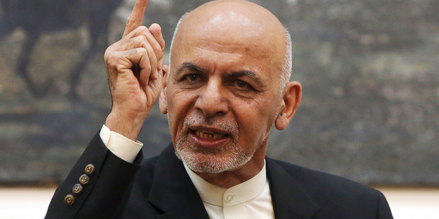 FILE - In this July 15, 2018, file photo, Afghan President Ashraf Ghani speaks during a press conference at the presidential palace in Kabul, Afghanistan. The Afghan government has fired its election commission, Tuesday, Feb. 12, 2019. The move by Ghani’s administration comes more than three months after chaotic parliamentary elections -- the results of which have still not been announced -- and ahead of July’s controversial presidential vote. (AP Photo/Rahmat Gul, File)