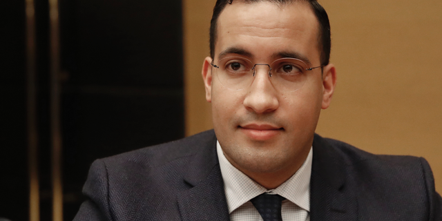 FILE - In this Jan.21, 2019 file photo, former President Macron's security aide Alexandre Benalla appears before the French Senate Laws Commission prior to his hearing, in Paris. French senators said Wednesday Feb.20, 2019 they believe the security of French President Emmanuel Macron has been affected by the conduct and actions of his former security aide, at the heart of a damaging political scandal. (AP Photo/Christophe Ena, File)