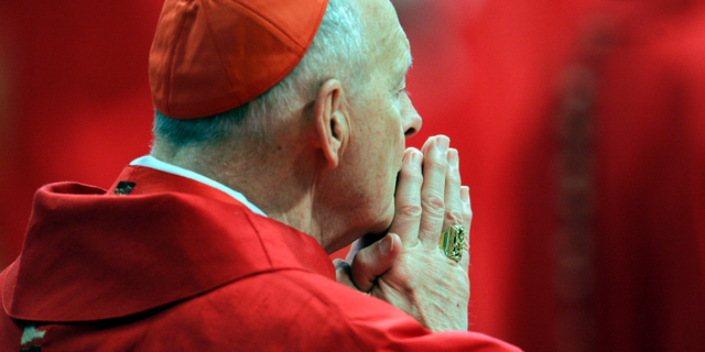 FILE - In this Monday, April 18, 2005 file photo, U.S. Cardinal Theodore Edgar McCarrick attends a Mass in St. Peter's Basilica at the Vatican. On Saturday, Feb. 16, 2019 the Vatican announced Pope Francis defrocked former U.S. Cardinal Theodore McCarrick after Vatican officials found him guilty of soliciting for sex while hearing Confession. (AP Photo/Pier Paolo Cito, files)