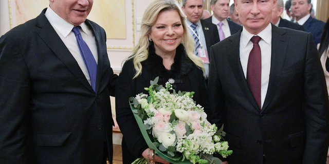 Russian President Vladimir Putin, right, Israeli Prime Minister Benjamin Netanyahu, and his wife Sara pose for a photo after talks in the Kremlin in Moscow, Russia, Wednesday, Feb. 27, 2019. Israel's prime minister vowed to prevent Iran from securing a lasting presence in Syria as he visited Moscow Wednesday for talks focusing on regional security. (Alexei Druzhinin, Sputnik, Kremlin Pool Photo via AP)