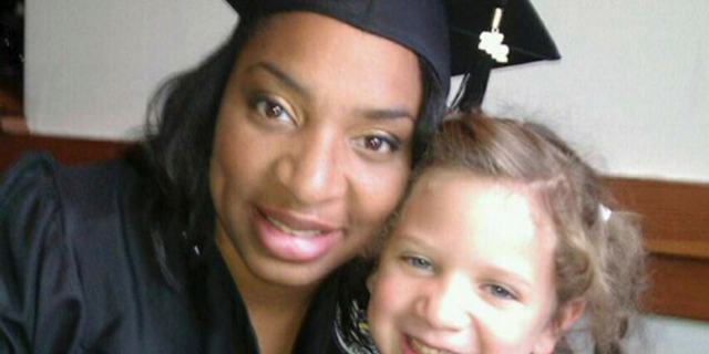 This undated selfie shows Amberkatherine DeCory with her daughter, Mila DeCory. Until her daughter could speak, Decory, a police officer who lives outside Minneapolis, carried her birth certificate and even a photo of her giving birth, just in case the African-American and Native American had to prove that her light-haired, blue-eyed child was truly her own. Families like theirs were not surprised when they heard that Cindy McCain reported a woman to police for possible human trafficking because McCain saw her at the airport with a toddler of a different ethnicity. (Amberkatherine DeCory via AP)