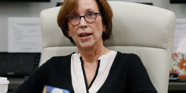 Chair of the University of Oklahoma Board of Regents, Dr. Leslie Rainbolt-Forbes announces that the Board of Regents will go into executive session during a special meeting in Oklahoma City, Wednesday, Feb. 20, 2019. (AP Photo/Sue Ogrocki)