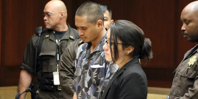 FILE - In this Jan. 31, 2019, file photo, Alins Sumang stands next to Deputy Public Defender Sarah Nishioka in court in Honolulu. Prosecutors say Sumang recklessly caused the deaths of Casimir Pokorny of Pennsylvania, Reino Ikeda of Japan and William Lau of Honolulu. Police say speed and alcohol appeared to factors in Monday's crash. (AP Photo/Jennifer Sinco Kelleher, File)