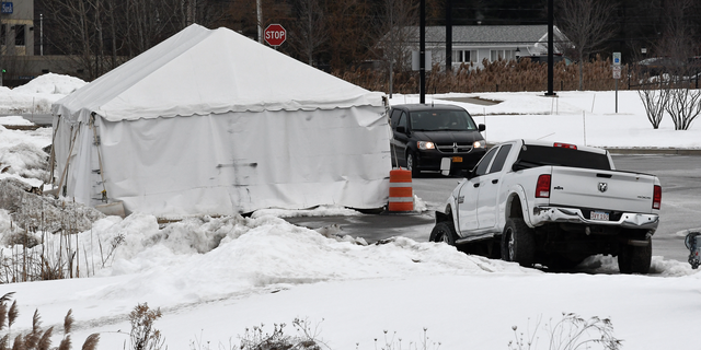 FILE - This Jan. 29, 2019, file photo shows a view of tent structure housing the wrecked limousine owned by Prestige Limousine involved in the Oct. 6, 2018, fatal accident in Schoharie County, behind the state police headquarters in Latham, N.Y. The National Transportation Safety Board's probe of a fatal limousine crash in upstate New York has not yet identified a cause, according to a preliminary report released Monday, Feb. 11, after weeks of wrangling between federal inspectors and a local prosecutor over access to physical evidence. (AP Photo/Hans Pennink, File)