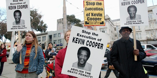 Protesters attend a rally in downtown San Francisco on Tuesday, February 3, 2004, to denounce Kevin Cooper's execution on February 10 at San Quentin State Penitentiary. Cooper was convicted of the murder of two children and two adults in a Chino Hills home soon after escaping from the California Men's Institution in Chino in 1983.