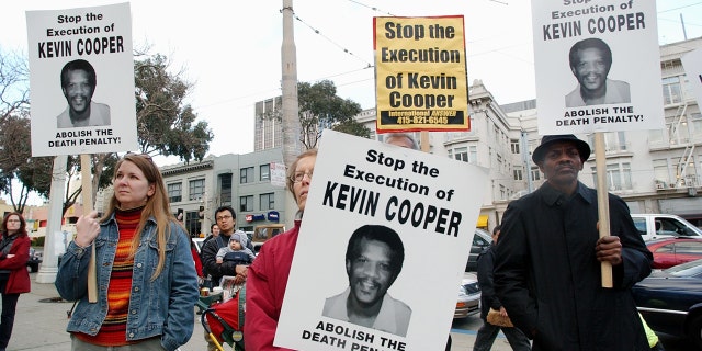 Protesters attend a rally in downtown San Francisco, Tuesday, Feb. 3, 2004, to denounce the Feb. 10 execution of Kevin Cooper at San Quentin State Penitentiary. Cooper was convicted of murdering two children and two adults in a Chino Hills home shortly after escaping from the California Institution for Men in nearby Chino in 1983.