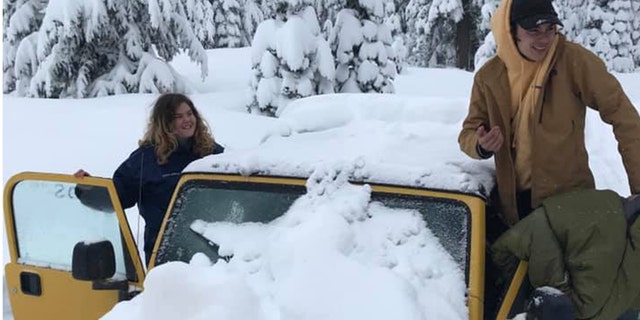 Carlos Hernandez-Isava and Maia Herman-Kitami were happy to be rescued after they were stranded in their Jeep for five days.
