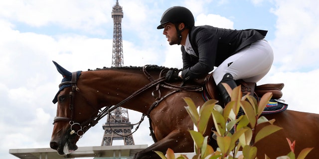 Venezuela's Emanuel Andrade riding Reus de la Nutria competes during the Paris Eiffel Jumping event on July 2, 2017 in Paris.