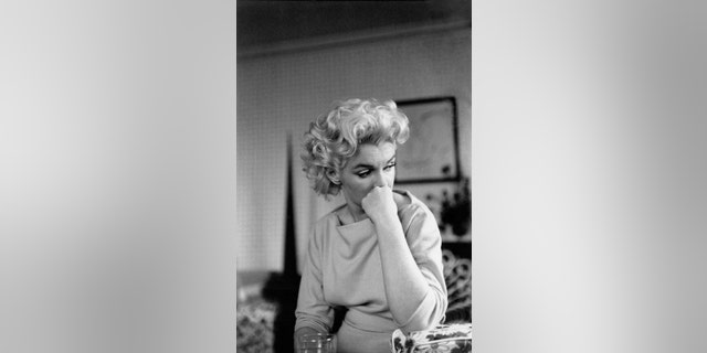 NEW YORK - MARCH 24: Actress Marilyn Monroe relaxes on a couch in her hotel room at the Ambassador Hotel on March 24, 1955 in New York City, New York.