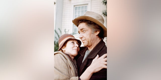 Actress Michael Learned embraces actor Ralph Waite in scene from the TV series "The Waltons."