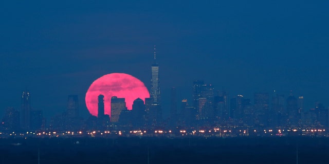 The super snow moon, which is the largest supermoon of 2019, rises behind lower Manhattan and One World Trade Center in New York City on Feb. 19, 2018 as seen from Green Brook Township, New Jersey. (Gary Hershorn/FOX News)