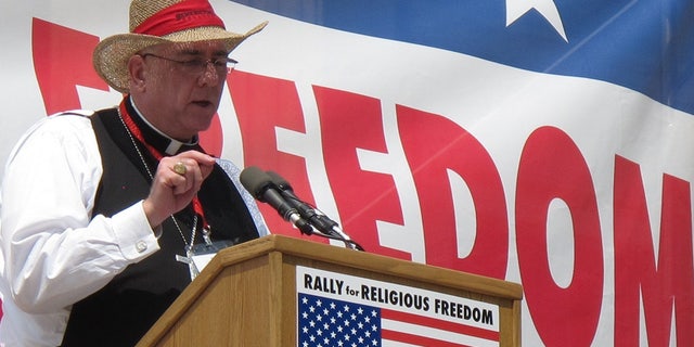Roman Catholic Archbishop Joseph Naumann, of Kansas City, Kan., speaks during a rally in June 2012, in Topeka, Kansas.