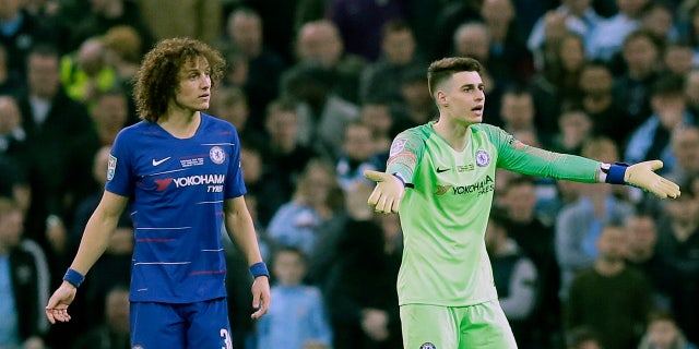 Chelsea goalkeeper Kepa Arrizabalaga, right, gesturing to the bench as captain David Luiz looked on during Sunday's League Cup final against Manchester City. (AP Photo/Tim Ireland)