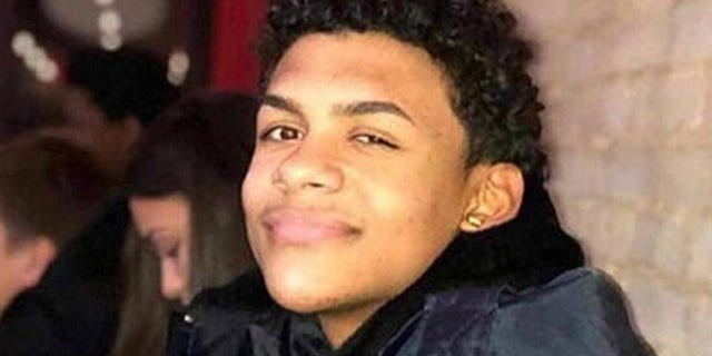 A suspect in the murder of Lesandro "Junior" Guzman-Feliz, pictured here, entered court on Monday holding a true-crime book about the murders of two prosecutors