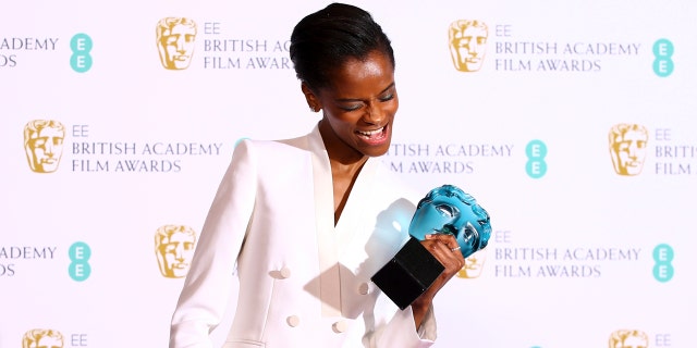 Actress Letitia Wright poses for photographers backstage with her Rising Star award at the BAFTA awards in London, Sunday, Feb. 10, 2019. (Photo by Joel C Ryan/Invision/AP)