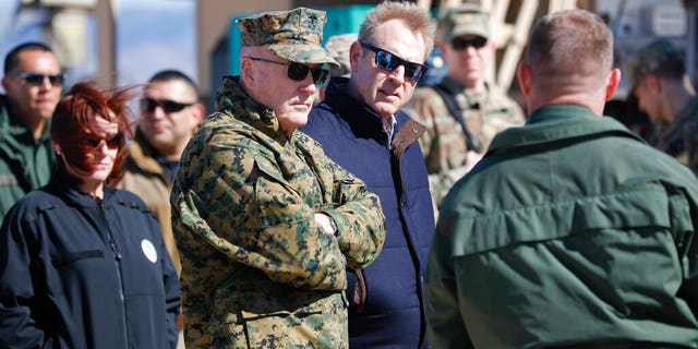 Acting Secretary of Defense Patrick Shanahan, center, and Joint Chiefs Chairman Gen. Joseph Dunford, left, tour the US-Mexico border at Santa Teresa Station in Sunland Park, N.M., Saturday, Feb. 23, 2019. Top defense officials toured sections of the U.S.-Mexico border Saturday to see how the military could reinforce efforts to block drug smuggling and other illegal activity, as the Pentagon weighs diverting billions of dollars for President Donald Trump's border wall. (AP Photo/Pablo Martinez Monsivais)
