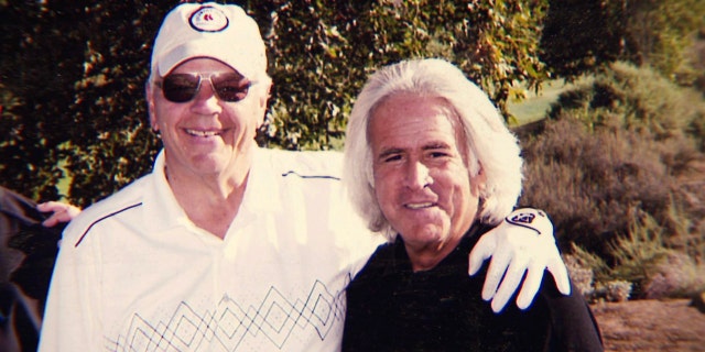 Bob Massi, right, poses with Fox News' Don Fair during a golf outing.