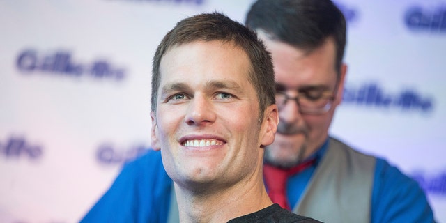 Super Bowl champion Tom Brady celebrates with a victory shave at Gillette World Shave headquarters on Thursday, Feb. 07, 2019 in Boston.