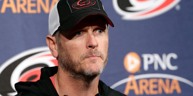 FILE - In this May 9, 2018, file photo, Carolina Hurricanes owner and CEO Tom Dundon takes questions during an NHL hockey news conference in Raleigh, N.C