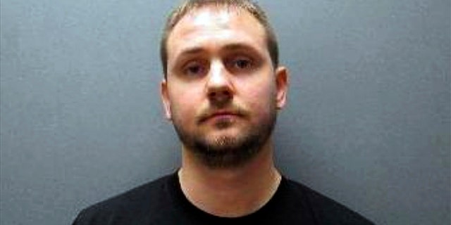 This undated booking photo released by Johnson County Sheriff's Office shows Nicholas Bridgmon. The Nebraska sheriff's deputy charged with sexually assaulting a woman more than a decade ago now is linked to at least five other victims before he joined the department in 2015. (Johnson County Sheriff's Office via AP)