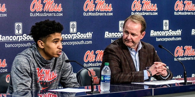 Mississippi guard Breein Tyree, left, speaks as head coach Kermit Davis listens at a news conference after the game, following an NCAA basketball game against Georgia Oxford, Missouri, Saturday, February 23, 2019. (Bruce Newman / The Oxford Eagle via AP)