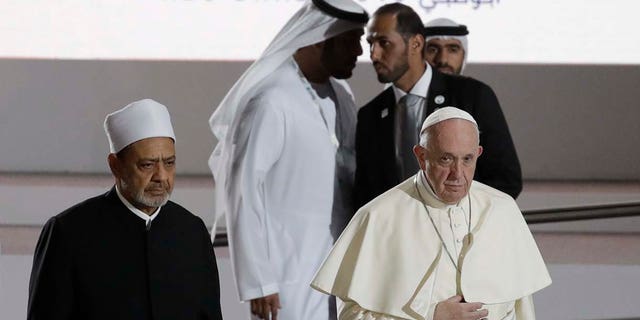 Pope Francis is flanked by Sheikh Ahmed el-Tayeb, the grand imam of Egypt's Al-Azhar as they arrive for an Interreligious meeting at the Founder's Memorial in Abu Dhabi, United Arab Emirates, Monday, Feb. 4, 2019. (AP Photo/Andrew Medichini)