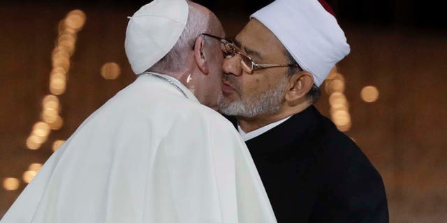 Pope Francis hugs Sheikh Ahmed el-Tayeb, the grand imam of Egypt's Al-Azhar, after an Interreligious meeting at the Founder's Memorial in Abu Dhabi, United Arab Emirates, Monday, Feb. 4, 2019. Pope Francis has asserted in the first-ever papal visit to the Arabian Peninsula that religious leaders have a duty to reject all war and commit themselves to dialogue. (AP Photo/Andrew Medichini)