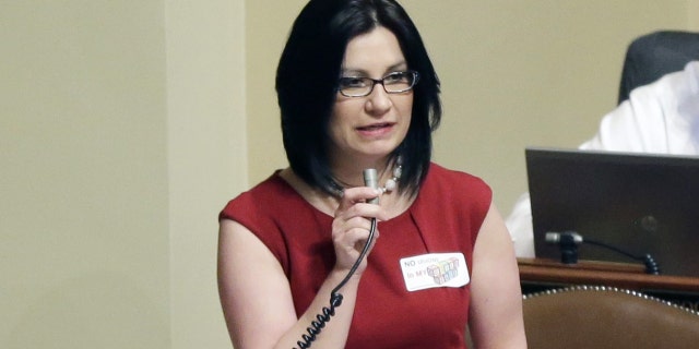 Rep. Mary Franson, R-Alexandria, voices her opposition to the bill to unionize day care providers during a debate as the Minnesota legislative session came to a close Monday, May 20, 2013, in St. Paul, Minn. (AP Photo/Jim Mone)