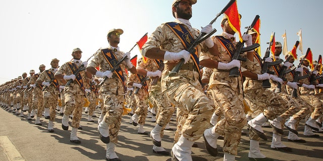 Members of the Iranian revolutionary guard march during a parade in Tehran, Iran.
