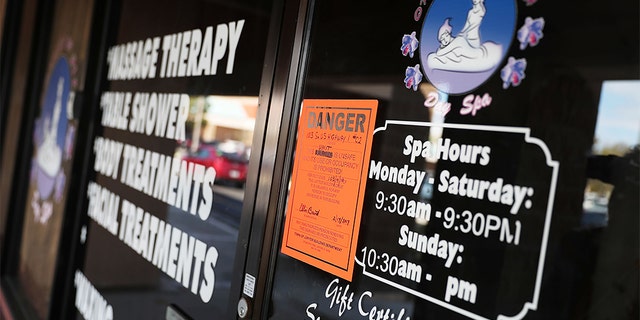 A Danger sign seen on the front door of the Orchids of Asia Day Spa last week in Jupiter, Fla., in connection to New England Patriots owner Robert Kraft being charged with allegedly soliciting for sex. (Photo by Joe Raedle/Getty Images)